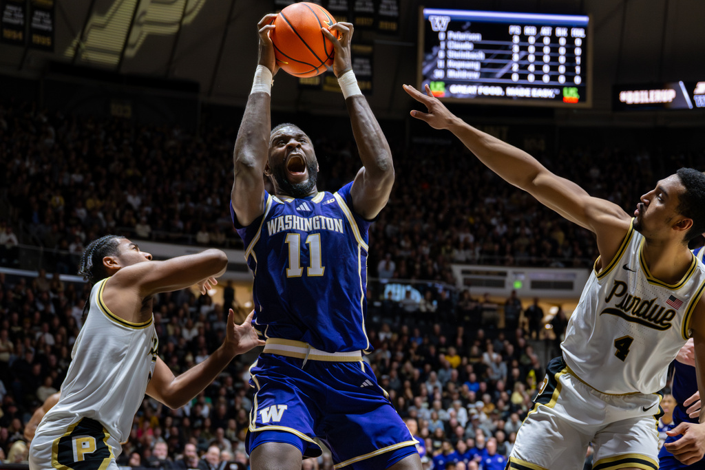 Washington center Franck Kepnang (11) drives toward the basket to shoot during the first half of an NCAA college basketball game against Purdue, Wednesday, Jan. 7, 2026, in West Lafayette, Ind. (AP Photo/Doug McSchooler)