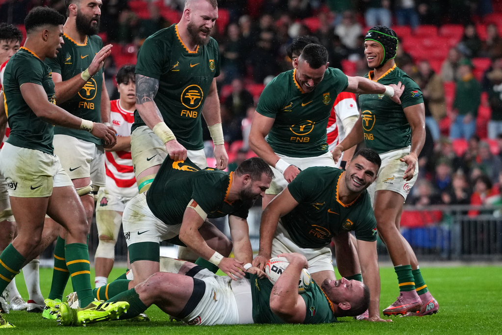 South Africa players celebrate scoring a try during the rugby union Nations Series match between South Africa and Japan in London, Saturday, Nov. 1, 2025 . (AP Photo/Kirsty Wigglesworth)