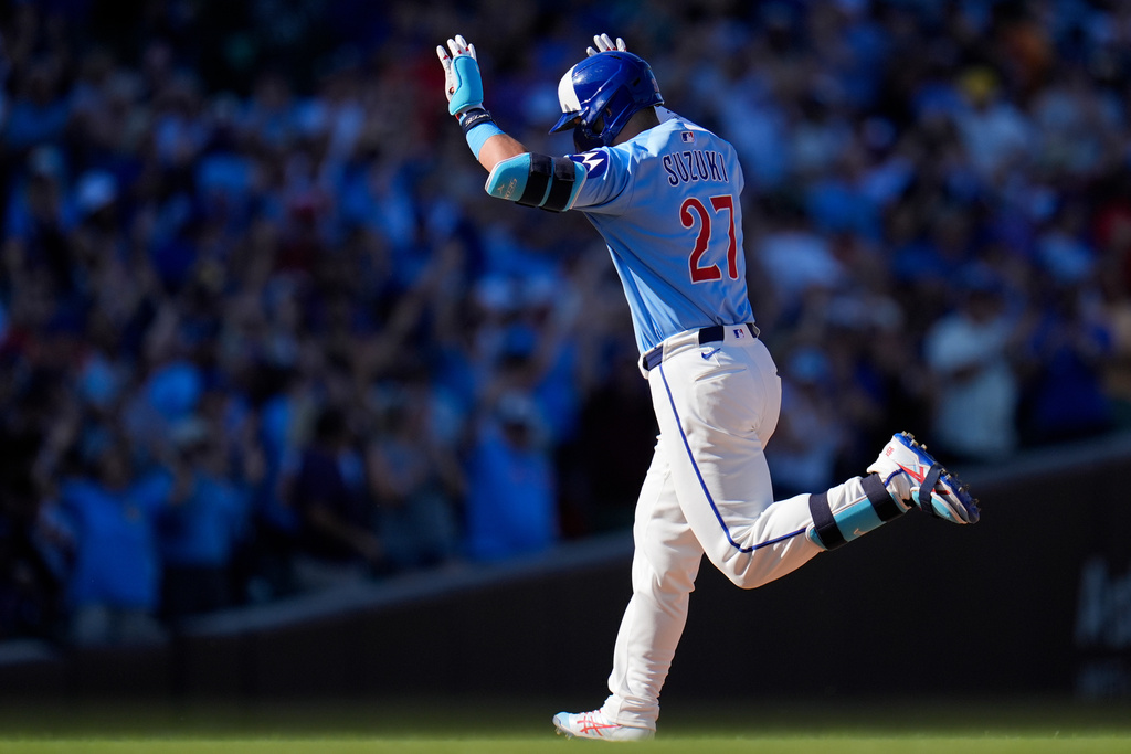 Chicago Cubs' Seiya Suzuki (27) runs the bases after hitting a grand slam during the seventh inning of a baseball game against the St. Louis Cardinals, Friday, Sept. 26, 2025, in Chicago. (AP Photo/Erin Hooley)
