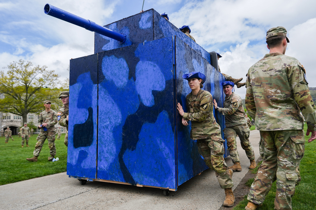 West Point cadets from the B2 Bulldogs company push a wooden tank down the plain while observing the crucible portion of the Sandhurst Military Skills Competition at the United States Military Academy in West Point, N.Y., Saturday, May 2, 2026. (AP Photo/Julia Demaree Nikhinson)
