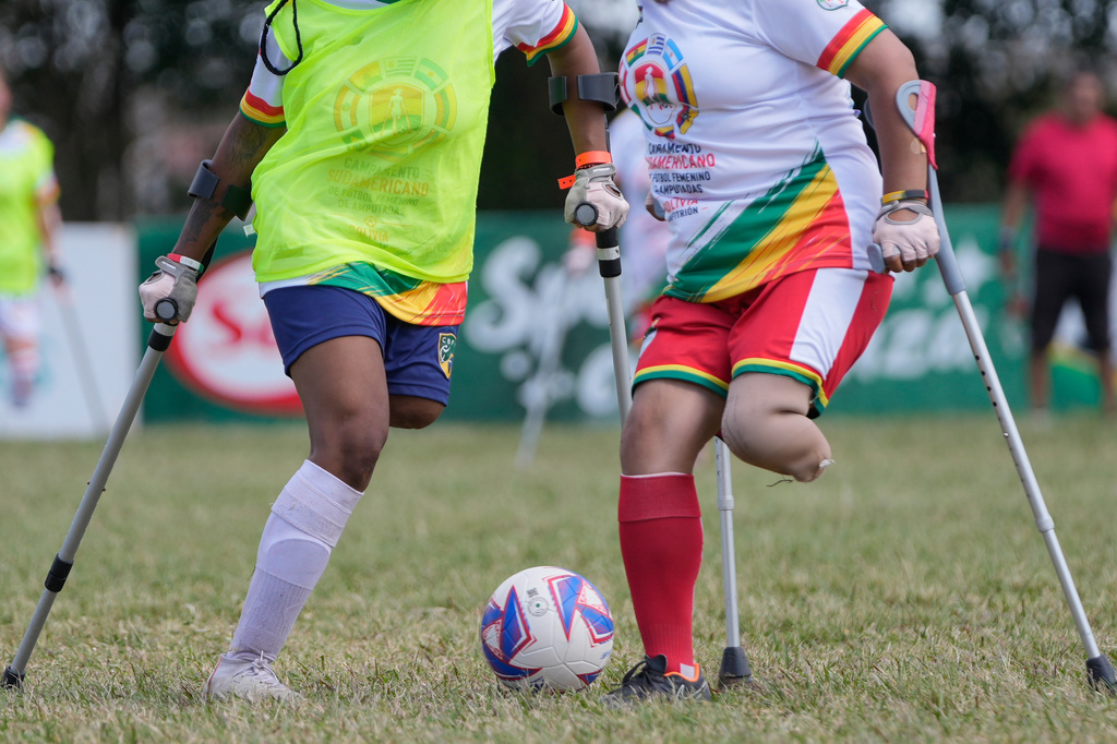 Players vie for the ball during a women's amputee soccer clinic Santa Cruz, Bolivia, Friday, July 17, 2026. (AP Photo/Juan Karita)