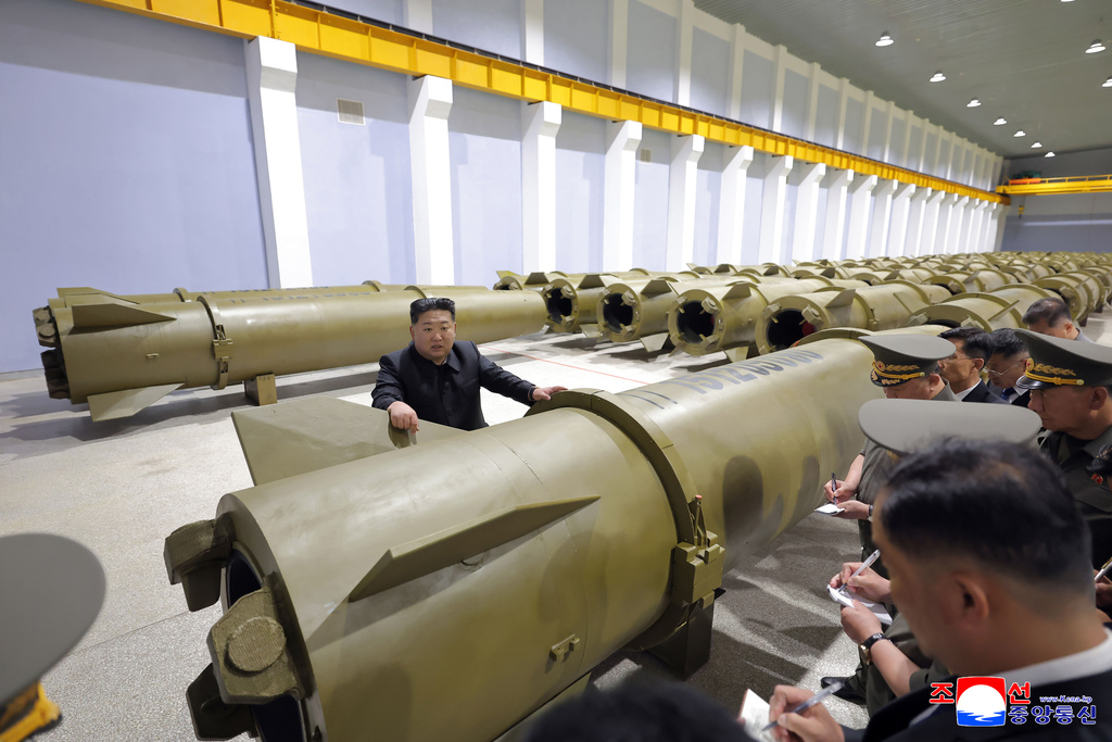 In this photo provided by the North Korean government, its leader Kim Jong Un, center, visits a weapons factory at an undisclosed place in North Korea Saturday, June 6, 2026. Independent journalists were not given access to cover the event depicted in this image distributed by the North Korean government. The content of this image is as provided and cannot be independently verified. Korean language watermark on image as provided by source reads: "KCNA" which is the abbreviation for Korean Central News Agency. (Korean Central News Agency/Korea News Service via AP)