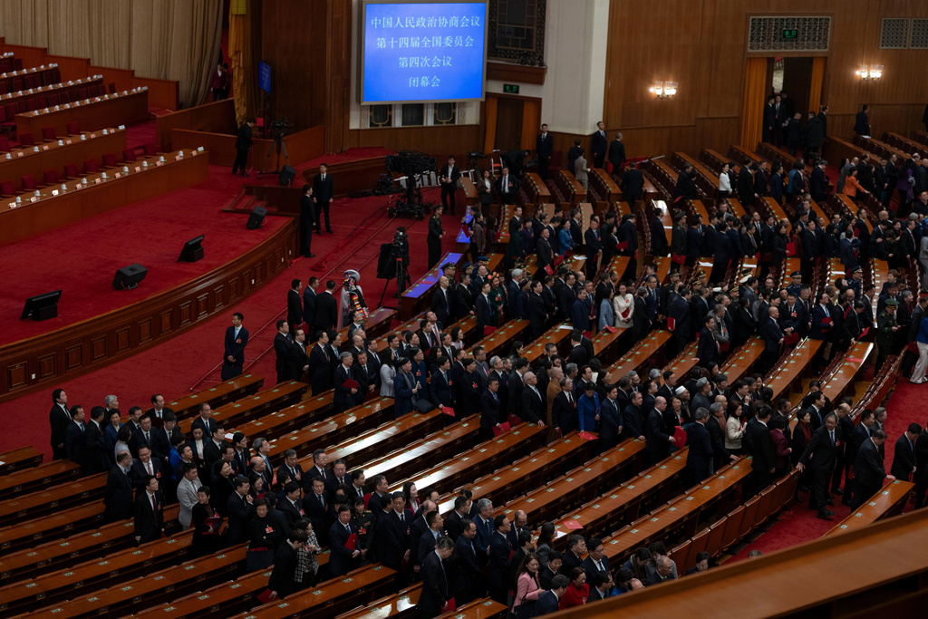 Delegates leave after the closing ceremony of the Chinese People's Political Consultative Conference (CPPCC), in Beijing, Wednesday, March 11, 2026. (AP Photo/Ng Han Guan)