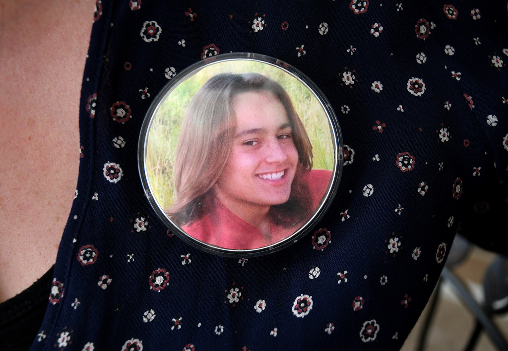 A photo of Max Osterman, whose mother says he died after taking fentanyl he bought from a dealer on Snapchat, is worn on his mother's blouse at her home in Thornton, Colo., on Thursday, March 26, 2026. (AP Photo/Thomas Peipert)