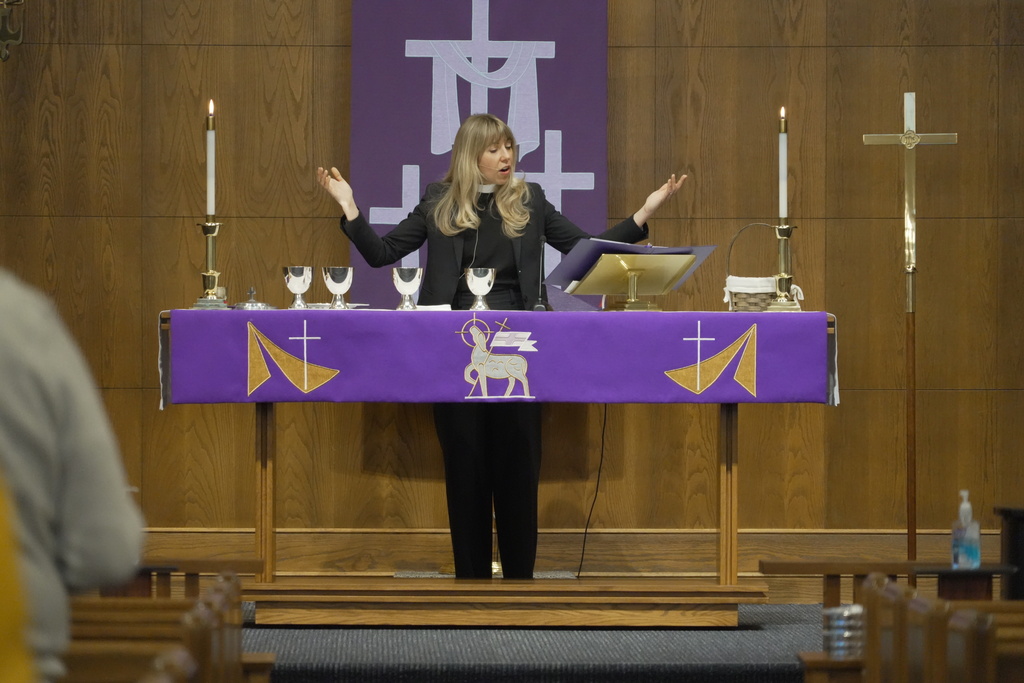 Rev. Sarah Trone Garriott, a Lutheran pastor and Iowa state senator, celebrates communion at Grace Lutheran Church in Des Moines, Iowa on Sunday, March 15, 2026. (AP Photo/Krysta Fauria)