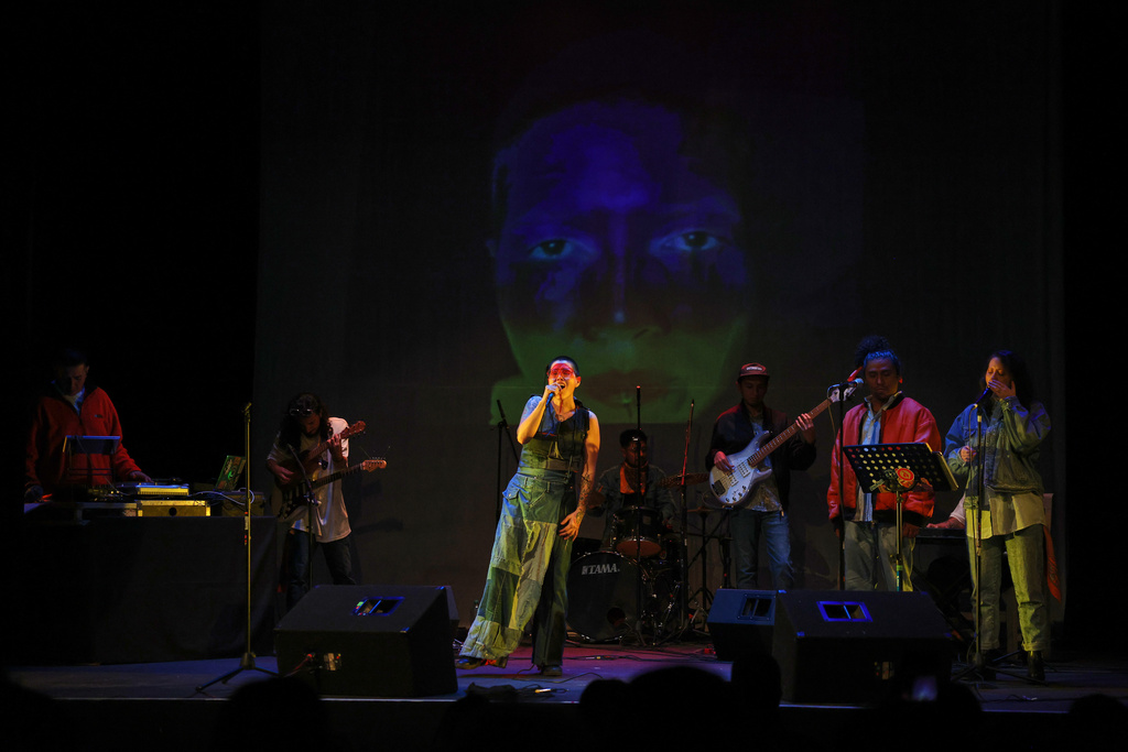 Mexican composer Maria Leonora performs her series she calls “Through All the Fire,” at the Sergio Magaña Theater in Mexico City, Friday, Nov. 28, 2025. (AP Photo/Claudia Rosel)