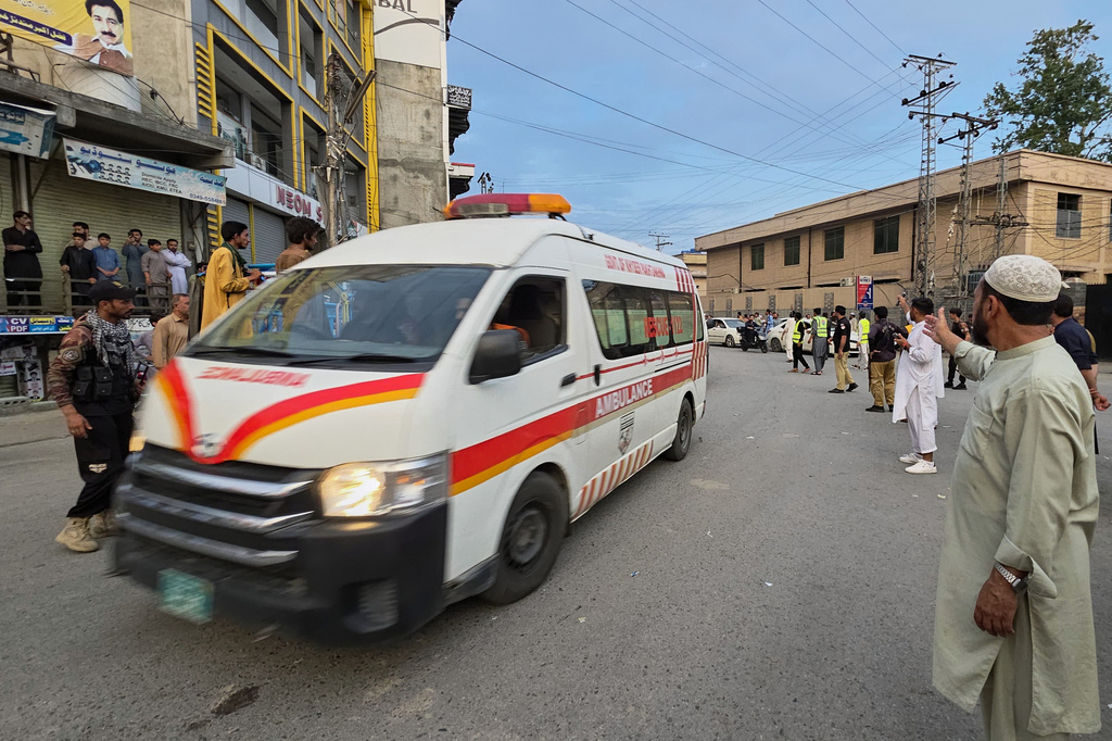 An ambulance rushes towards the hospital carrying injured victims from the site of a suicide bombing, in Kabal, a town in the Swat Valley in Pakistan's Khyber Pakhtunkhwa province, Sunday, Aug. 2, 2026. (AP Photo/Sherin Zada)