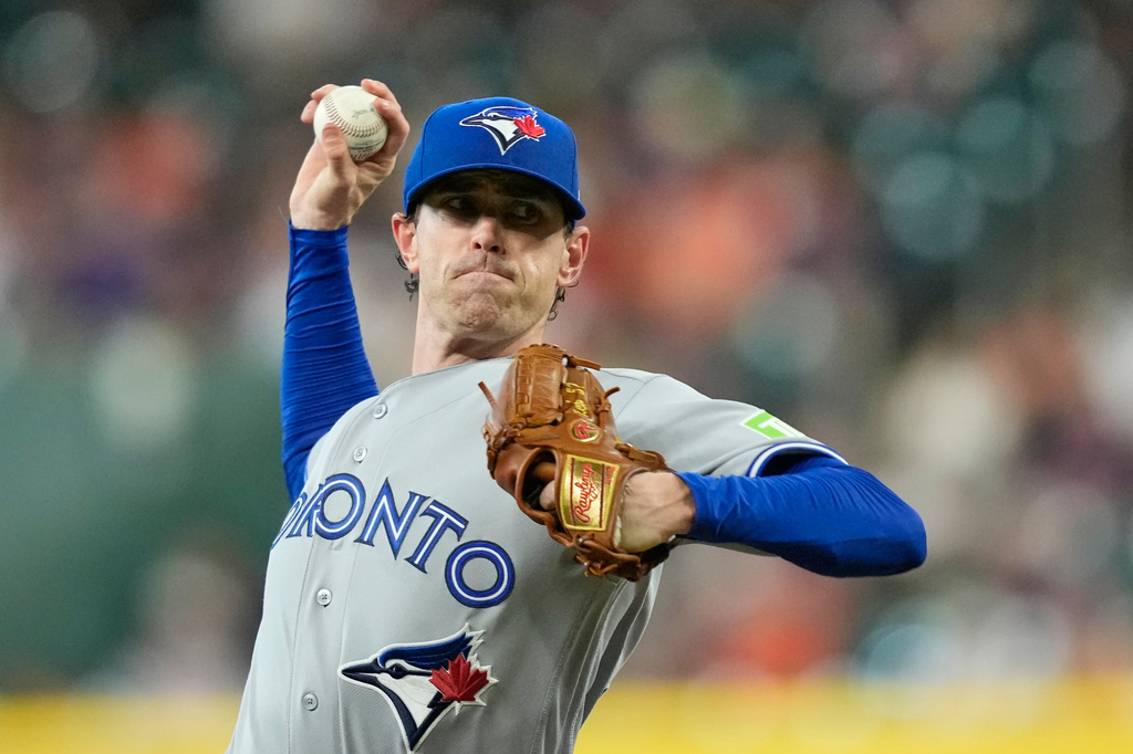 Toronto Blue Jays starting pitcher Shane Bieber throws during the first inning of a baseball game against the Houston Astros Monday, Aug. 3, 2026, in Houston. (AP Photo/David J. Phillip)