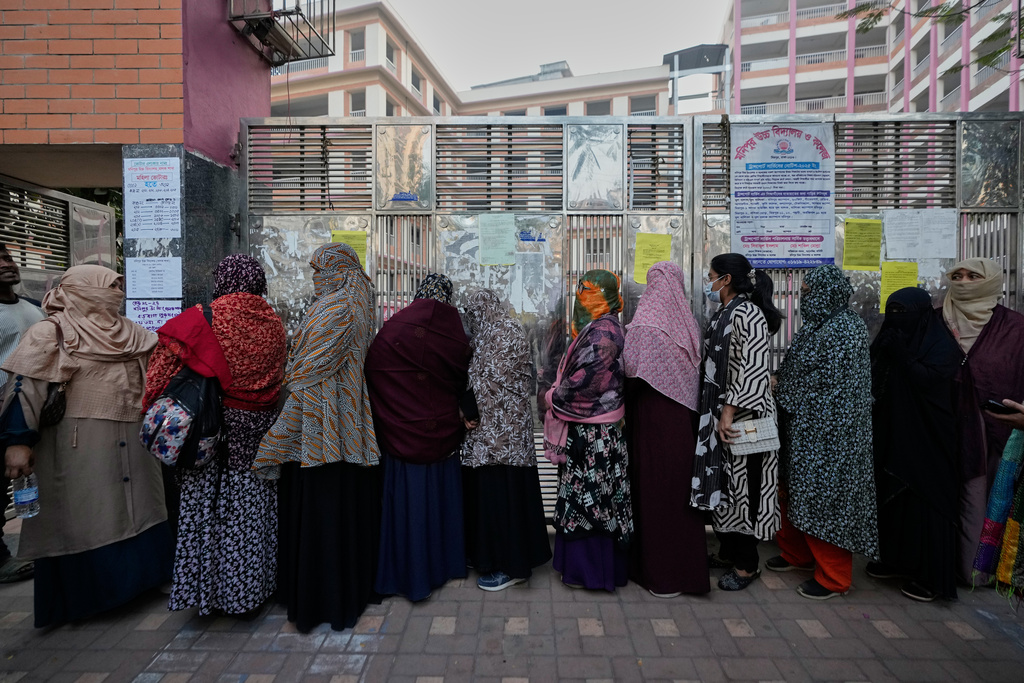 Bangladeshi women stand in queue to cast their votes in a polling station during national parliamentary election in Dhaka, Bangladesh, Thursday, Feb. 12, 2026. (AP Photo/Anupam Nath)