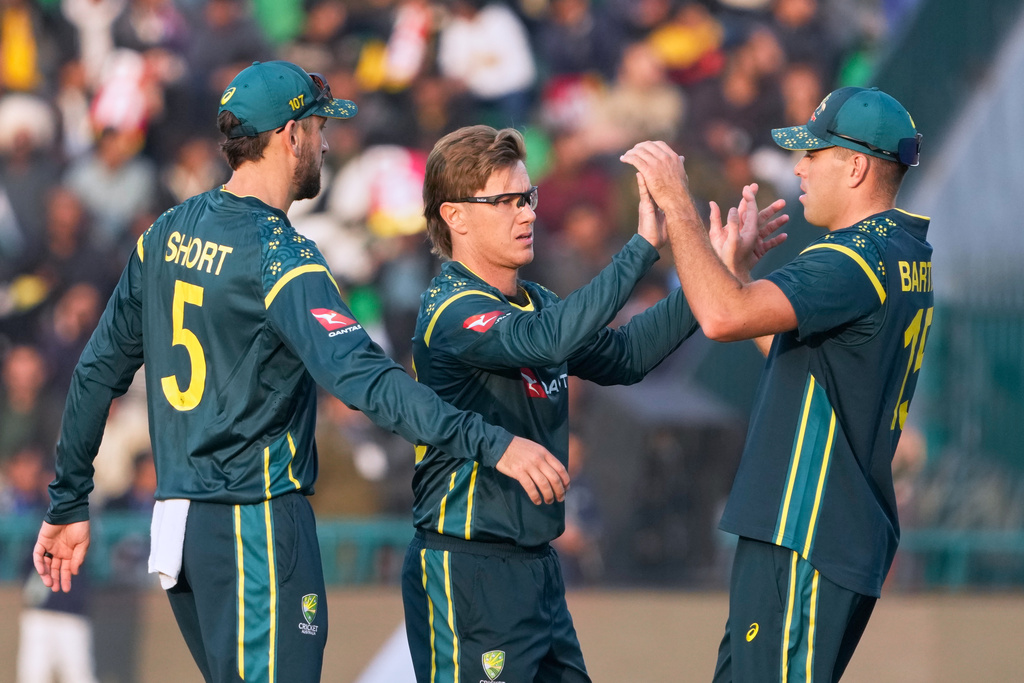 Australia's Adam Zampa, center, celebrates with teammates after the dismissal of Pakistan's Salman Ali Agha during the first T20 cricket match between Pakistan and Australia, in Lahore, Pakistan, Thursday, Jan. 29, 2026. (AP Photo/K.M. Chaudary)