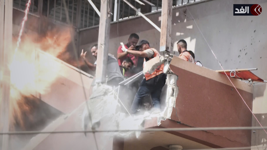 This frame grab taken from a video released by Al Ghad TV shows the second of two rounds of Israeli strikes hitting the outside stairs of Nasser Hospital, minutes after the first, in Khan Younis, southern Gaza Strip, Monday, Aug. 25, 2025. (Al Ghad TV via AP)
