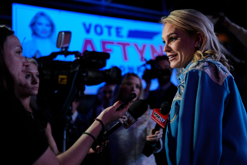Democratic candidate State Rep. Aftyn Behn, D-Nashville, right, speaks to reporters at watch party after losing a special election for the U.S. seventh congressional district, Tuesday, Dec. 2, 2025, in Nashville, Tenn. (AP Photo/George Walker IV)