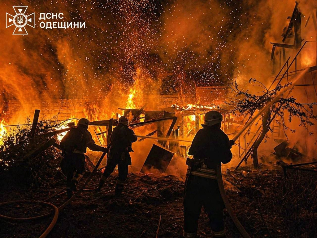 In this photo provided by the Ukrainian Emergency Services on Wednesday, April 29, 2026, rescue workers put out a fire of a residential building destroyed by a Russian drone strike on Odesa region, Ukraine. (Ukrainian Emergency Service via AP)