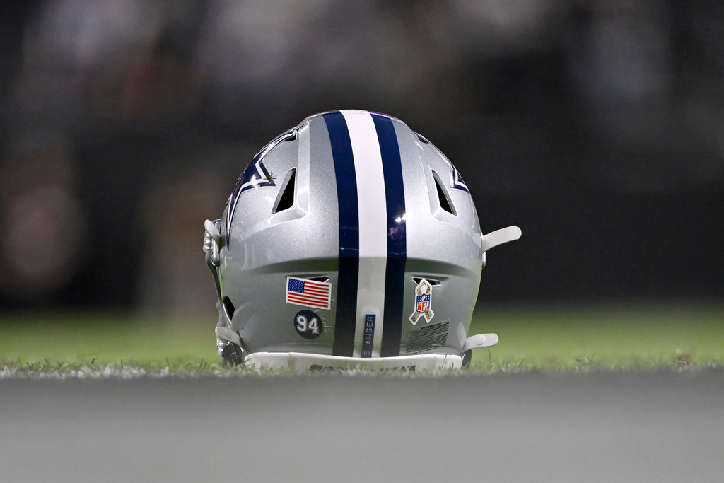 Dallas Cowboys punter Bryan Anger's helmet has Cowboys' Marshawn Kneeland #94 on it prior to an NFL football game against the Las Vegas Raiders Monday, Nov. 17, 2025, in Las Vegas, in memory of Kneeland who passed away earlier this month. (AP Photo/David Becker)