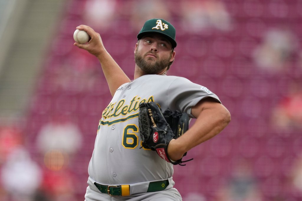 Athletics pitcher Mason Barnett throws during the first inning of a baseball game against the Cincinnati Reds in Cincinnati, Thursday, Aug. 6, 2026. (AP Photo/Carolyn Kaster)