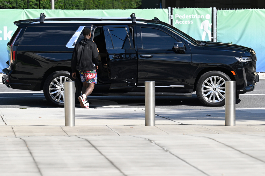 Miami Heat guard Terry Rozier gets into a limousine after leaving the federal courthouse through a side door after his arraignment, Thursday, Oct. 23, 2025, in Orlando, Fla. (AP Photo/Phelan M. Ebenhack)