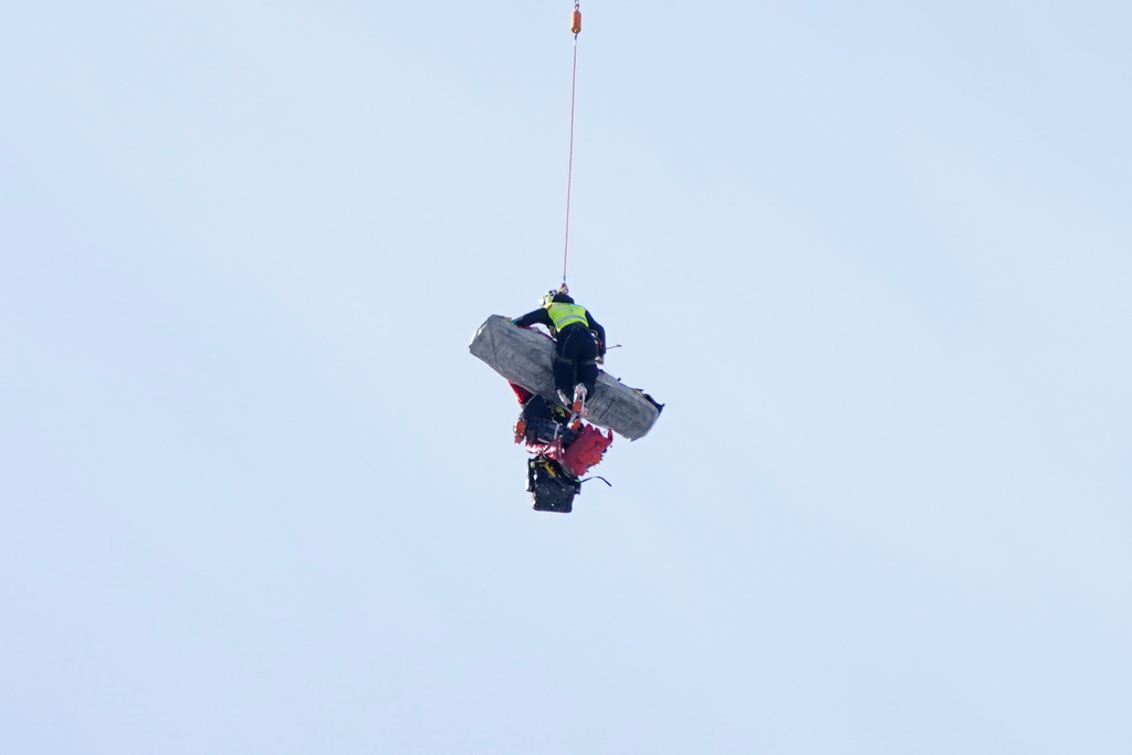 Chile's Henrik von Appen is airlifted after crashing during an alpine ski, men's World Cup downhill, in Crans Montana, Switzerland, Sunday, Feb. 1, 2026. (AP Photo/Giovanni Auletta)