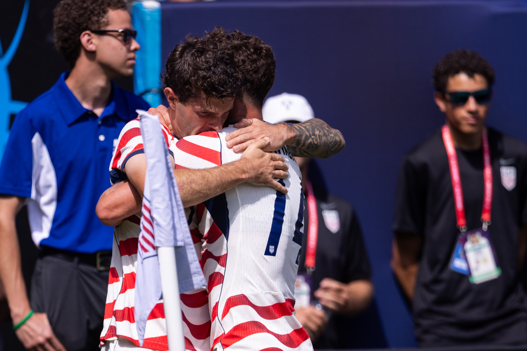 United States forward Christian Pulisic, center left, celebrates with midfielder Sebastian Berhalter (14) after scoring in the first half against Senegal in an international friendly soccer match Sunday, May 31, 2026, in Charlotte, N.C. (AP Photo/Scott Kinser)