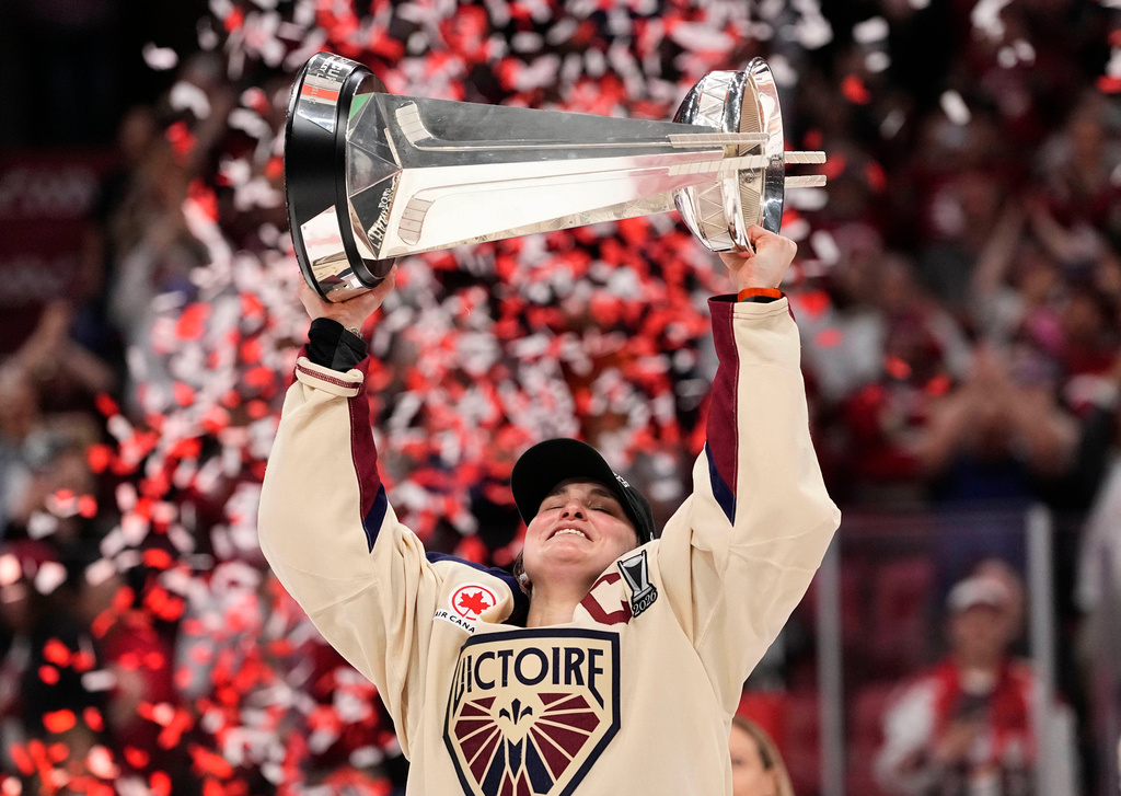 Montreal Victoire's Marie-Philip Poulin (29) raises the PWHL Walter Cup after the team's win against the Ottawa Charge, in Ottawa, on Wednesday, May 20, 2026. (Justin Tang/The Canadian Press via AP) CORRECTION: name of photographer Justin Tang
