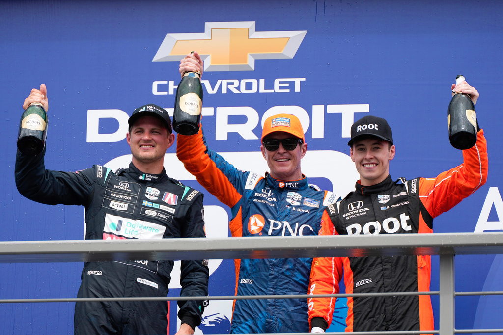 FILE - From left, second placed Marcus Ericsson, first placed Scott Dixon, and third placed Marcus Armstrong celebrate after the IndyCar Detroit Grand Prix auto race in Detroit, June 2, 2024. (AP Photo/Paul Sancya, File)