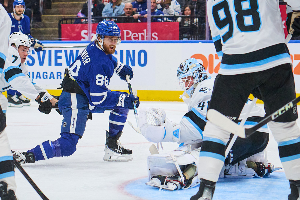 Toronto Maple Leafs' William Nylander (88) scores against the Utah Mammoth goaltender Vitek Vanecek (41) during second period NHL hockey action in Toronto, on Wednesday, Nov. 5, 2025. (Sammy Kogan/The Canadian Press via AP)