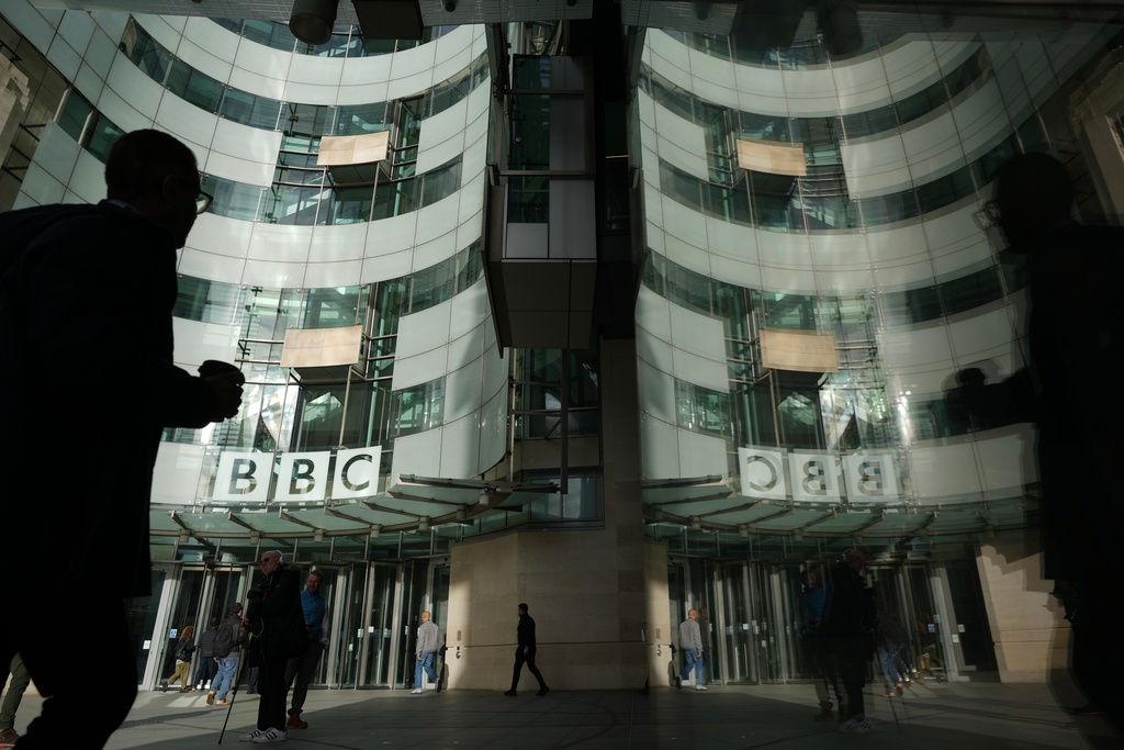 FILE - Pedestrian walks outside the BBC Headquarters in London, Wednesday, Nov. 12, 2025. (AP Photo/Kin Cheung, file)