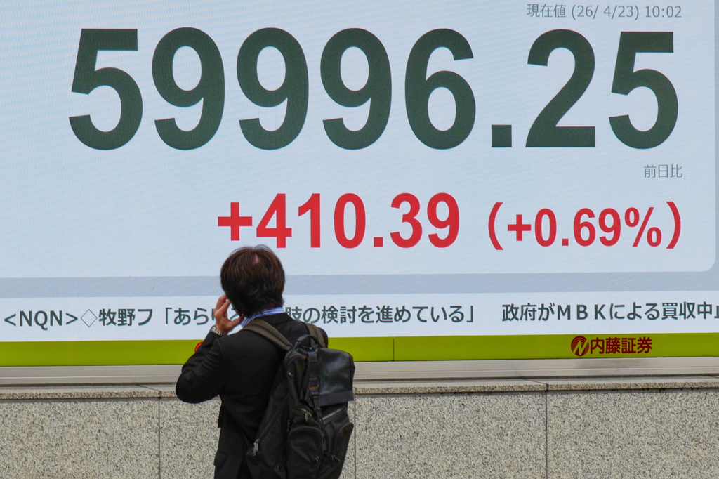 A person looks at an electronic stock board showing Japan's Nikkei index at a securities firm Thursday, April 23, 2026, in Tokyo. (AP Photo/Eugene Hoshiko)