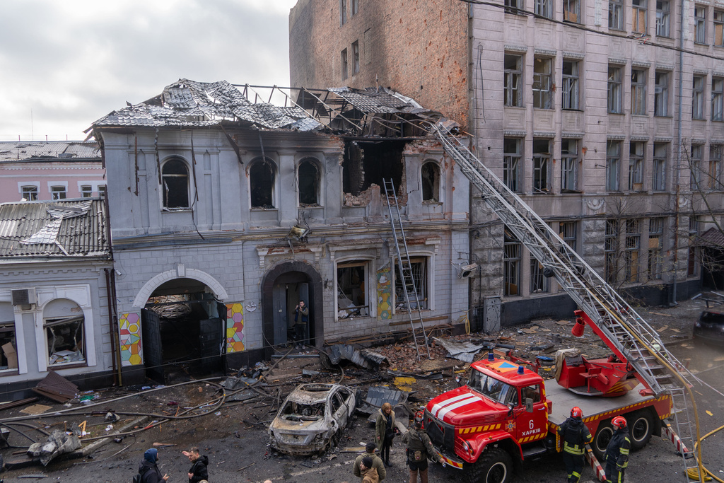 Firefighters put out the fire after Russian drones hit a city kindergarten during an air attack in Kharkiv, Ukraine, Wednesday, Oct. 22, 2025. (AP Photo/Andrii Marienko)