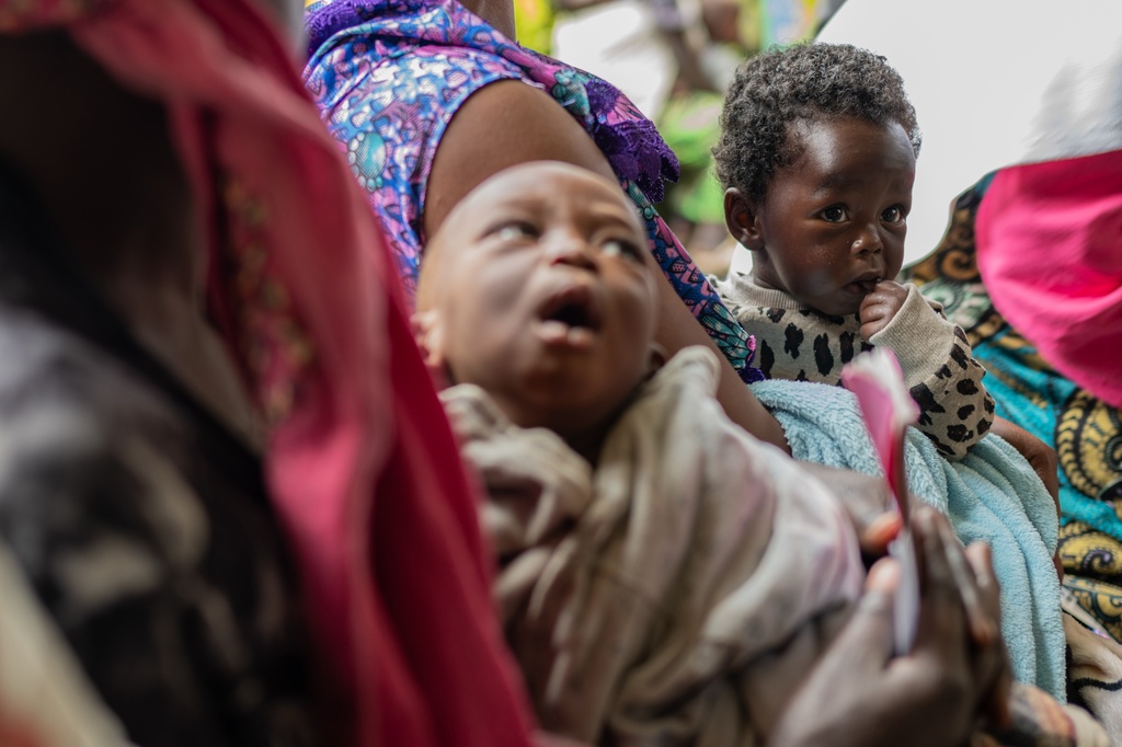 Children wait to receive a measles vaccination at the Kachehembe health center in Rubaya, eastern Democratic Republic of Congo, Monday, Dec. 1, 2025. (AP Photo/Moses Sawasawa)
