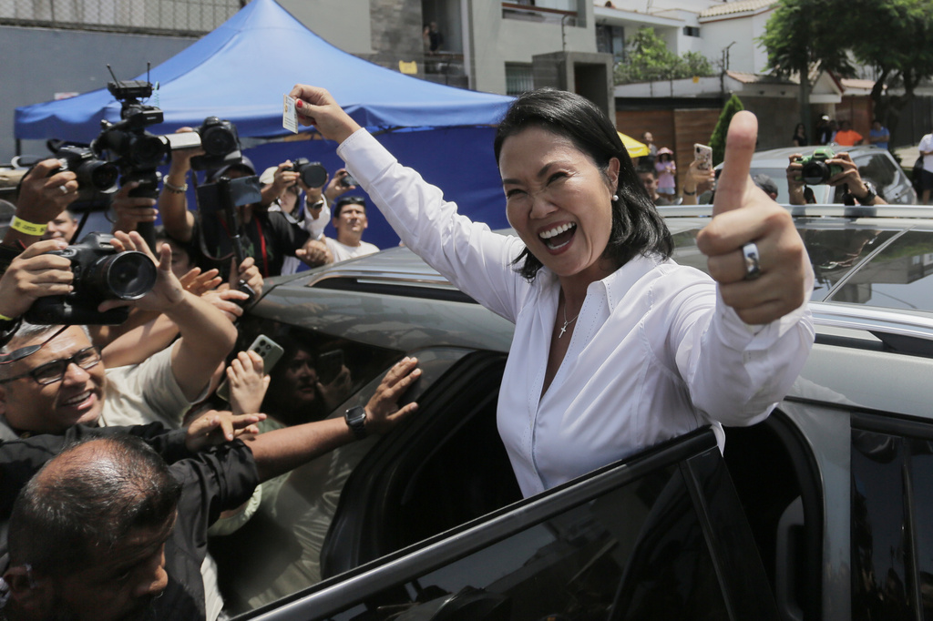 Keiko Fujimori, presidential candidate of the Popular Force party, departs a polling station after voting during general elections in Lima, Peru, Sunday, April 12, 2026. (AP Photo/Gerardo Marin)