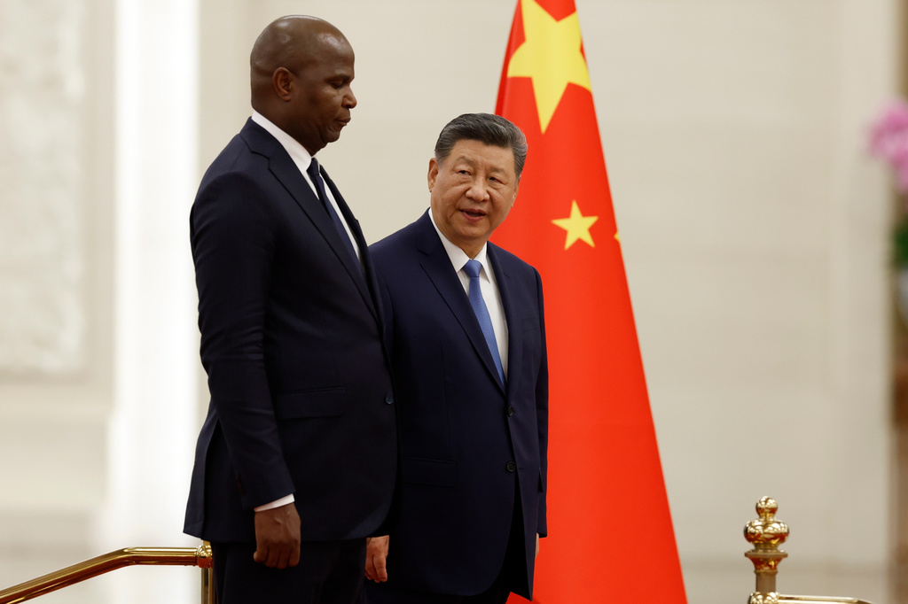 China's President Xi Jinping, right, and Mozambique's President Daniel Chapo attend a welcoming ceremony at the Great Hall of the People in Beijing Tuesday, April 21, 2026. (Haruna Furuhashi/Pool Photo via AP)