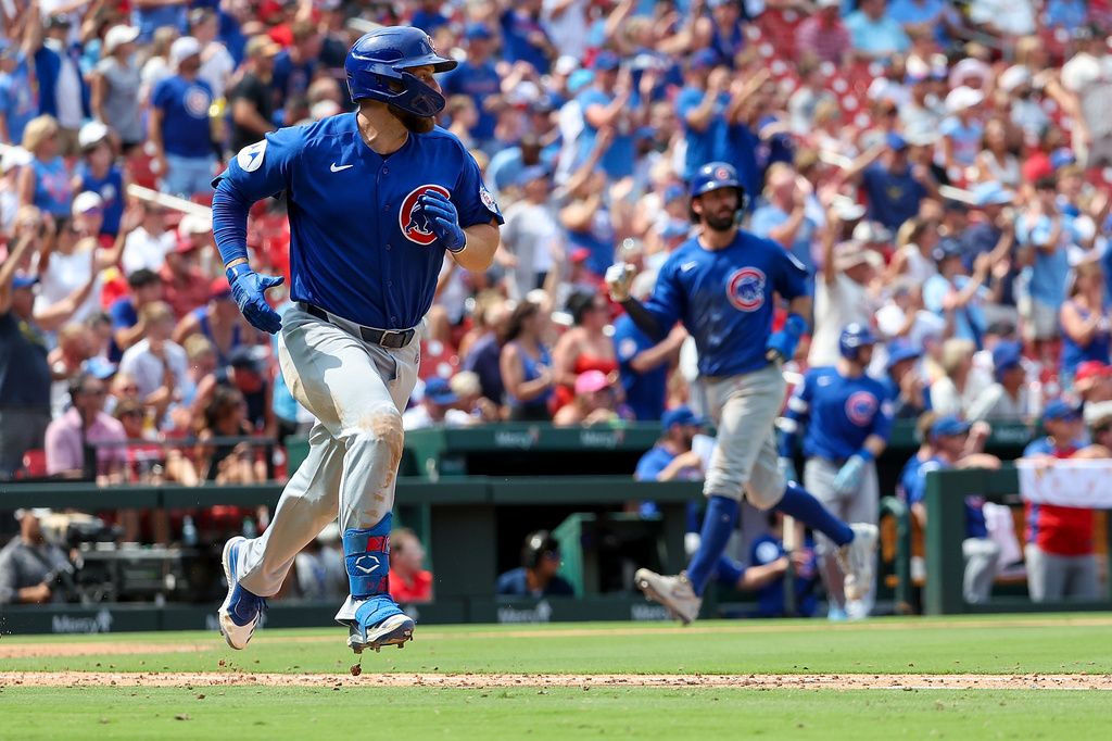 Chicago Cubs' Michael Busch runs up the baseline after hitting an RBI single during the seventh inning of a baseball game against the St. Louis Cardinals, Thursday, July 30, 2026, in St. Louis. (AP Photo/Scott Kane)