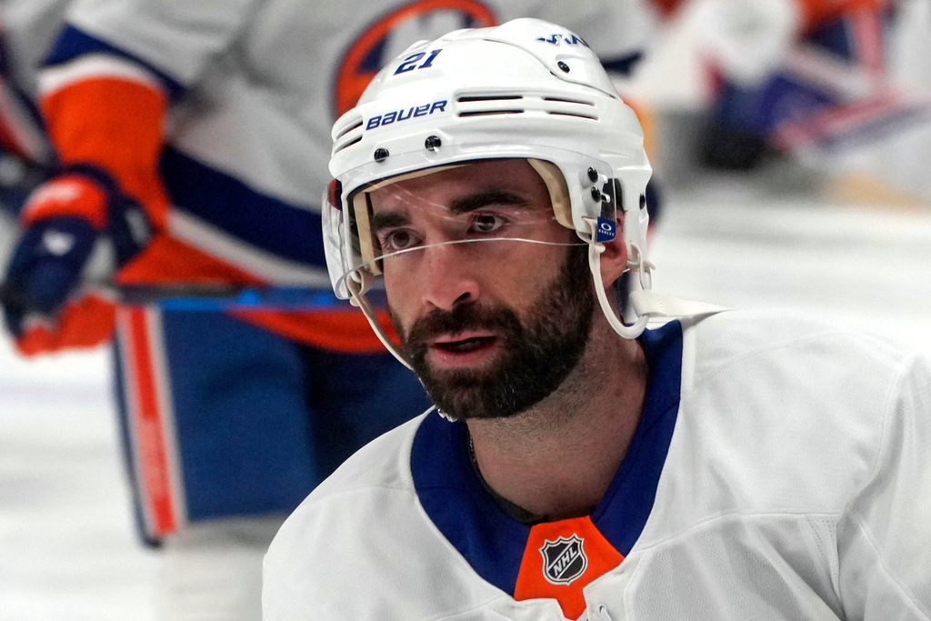 New York Islanders' Kyle Palmieri (21) skates during warm ups before an NHL hockey game against the Pittsburgh Penguins in Pittsburgh, Thursday, Oct. 9, 2025. (AP Photo/Gene J. Puskar)