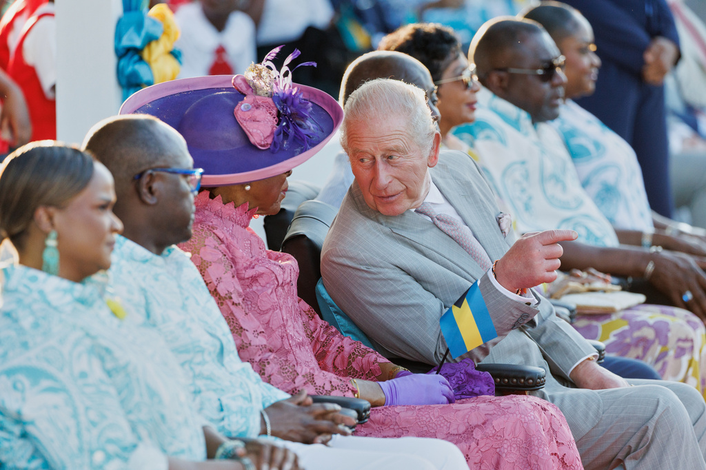 Britain's King Charles III chats with Governor General of The Bahamas Cynthia Pratt at The Future Bahamas Youth Rally and Exhibition at Clifford Park in Nassau, Bahamas, Tuesday, Oct. 27, 2026. (AP Photo/Tim Aylen)