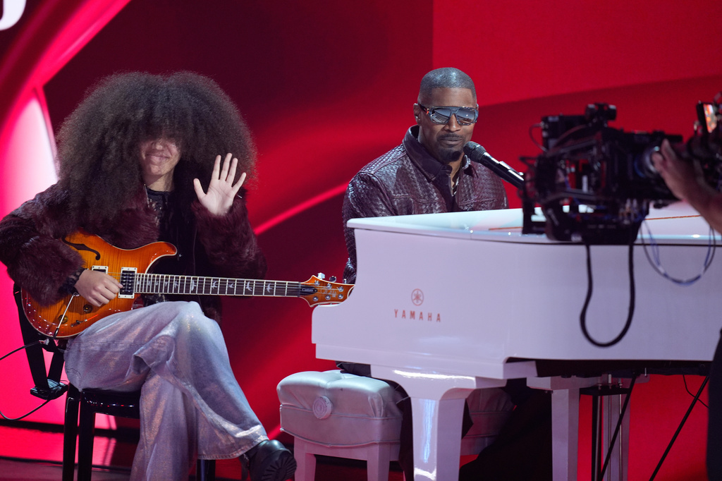 Anelise Bishop, left, and Jamie Foxx perform during the BET Awards on Sunday, June 28, 2026, at the Peacock Theater in Los Angeles. (AP Photo/John Locher)