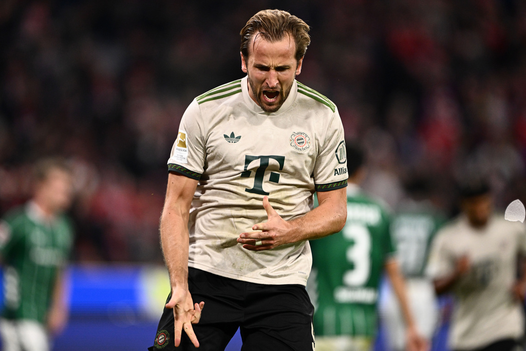 Bayern's Harry Kane celebrates scoring from the penalty spot during the Bundesliga soccer match between Bayern Munich and Werder Bremen at the Allianz Arena in Munich, Germany, Friday, Sept. 26, 2025. (Harry Langer/dpa via AP)