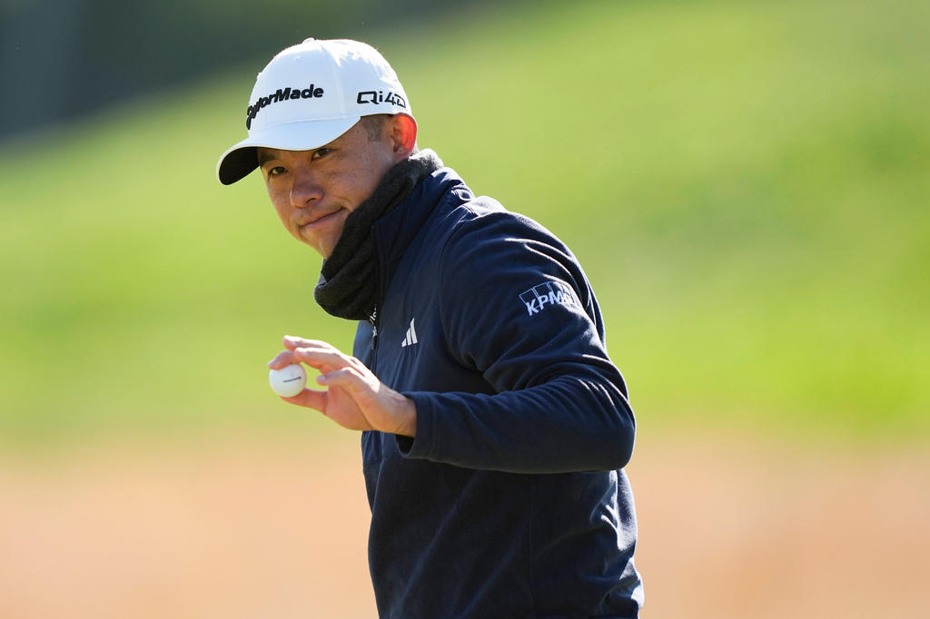 Collin Morikawa waves on the 10th hole during the second round of the PGA Championship golf tournament at Aronimink Golf Club, Friday, May 15, 2026, in Newtown Square, PA. (AP Photo/Matt Slocum)