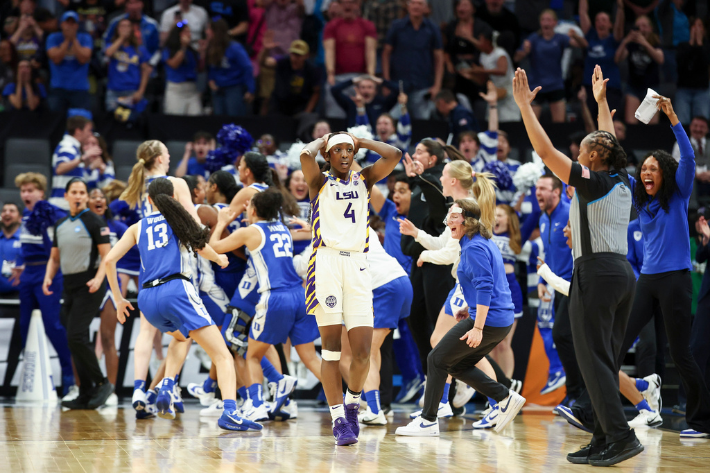 LSU guard Flau'jae Johnson (4) reacts after Duke guard Ashlon Jackson, not shown, makes a 3-pointer to win the Sweet 16 of the NCAA college basketball tournament Friday, March 27, 2026, in Sacramento, Calif. (AP Photo/Sara Nevis)
