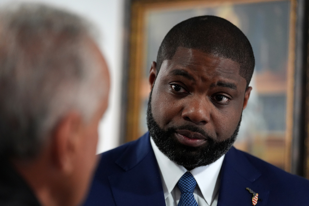 Florida Republican congressman and gubernatorial candidate Byron Donalds talks with a member of the Hispanic Police Officers Association in Doral, Fla., after receiving the group's endorsement, Thursday, Aug. 6, 2026. (AP Photo/Rebecca Blackwell)