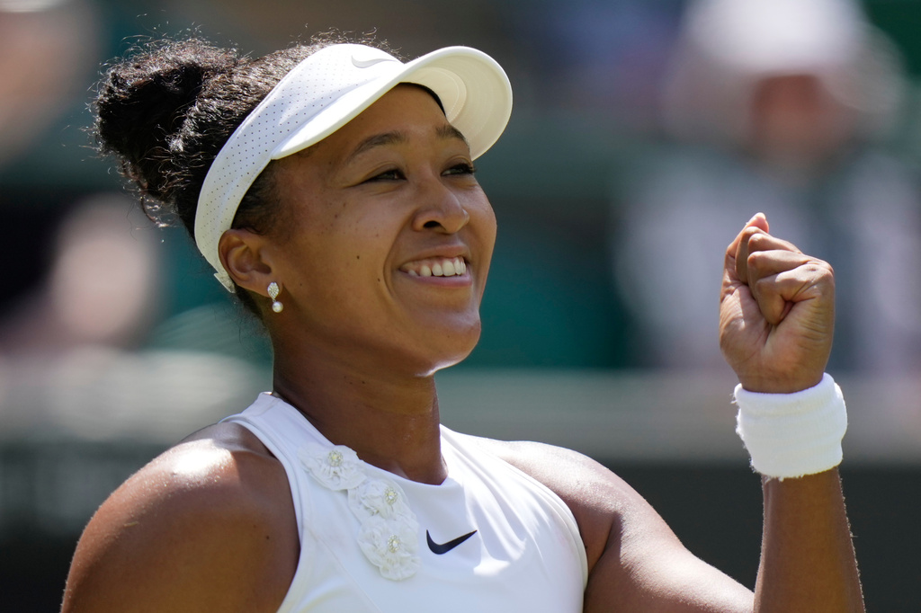 Naomi Osaka of Japan celebrates winning the third round women's singles match against Daria Kasatkina of Australia at the Wimbledon Tennis Championships in London, Friday, July 3, 2026.(AP Photo/Brian Inganga)