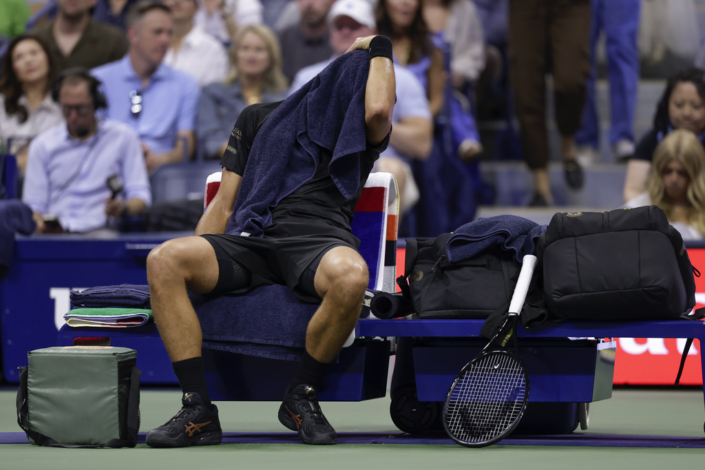 Novak Djokovic, of Serbia, takes a break during a changeover in the first set against Jan-Lennard Struff, of Germany, during the fourth round of the U.S. Open tennis championships, Sunday, Aug. 31, 2025, in New York. (AP Photo/Adam Hunger)