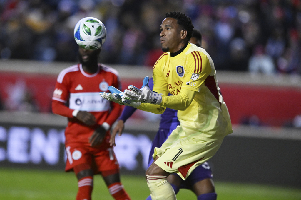 Orlando City SC goalie Pedro Gallese makes a save during the the first half of an MLS soccer wild-card playoff match against Chicago Fire FC, Wednesday, Oct. 22, 2025, in Bridgeview, Ill. (AP Photo/Paul Beaty)