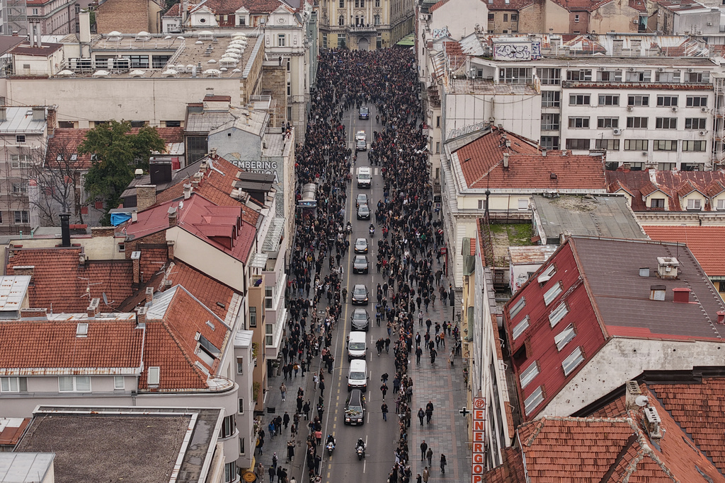 Thousands of people attend the funeral of popular Bosnian folk singer Halid Beslic, who also was also widely known for his humanitarian work during and after the country's bloody 1992-95 war, in Sarajevo, Bosnia, Monday, Oct. 13, 2025. (AP Photo/Armin Durgut)