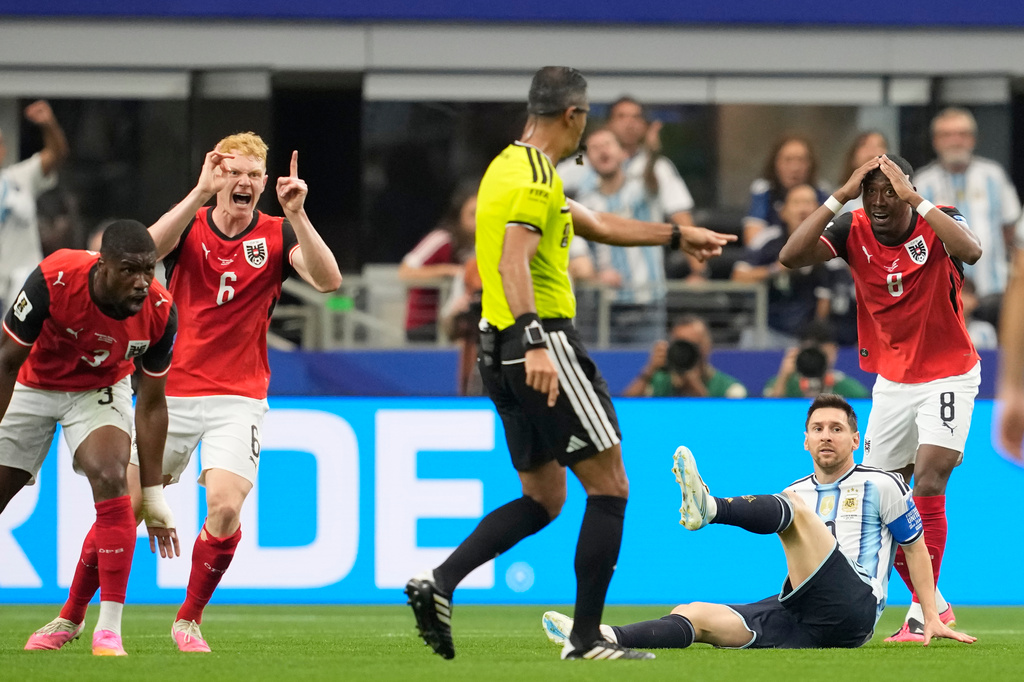 Argentina's Lionel Messi falls during the World Cup Group J soccer match against Austria in Arlington, Texas, near Dallas, Monday, June 22, 2026. (AP Photo/Tony Gutierrez)