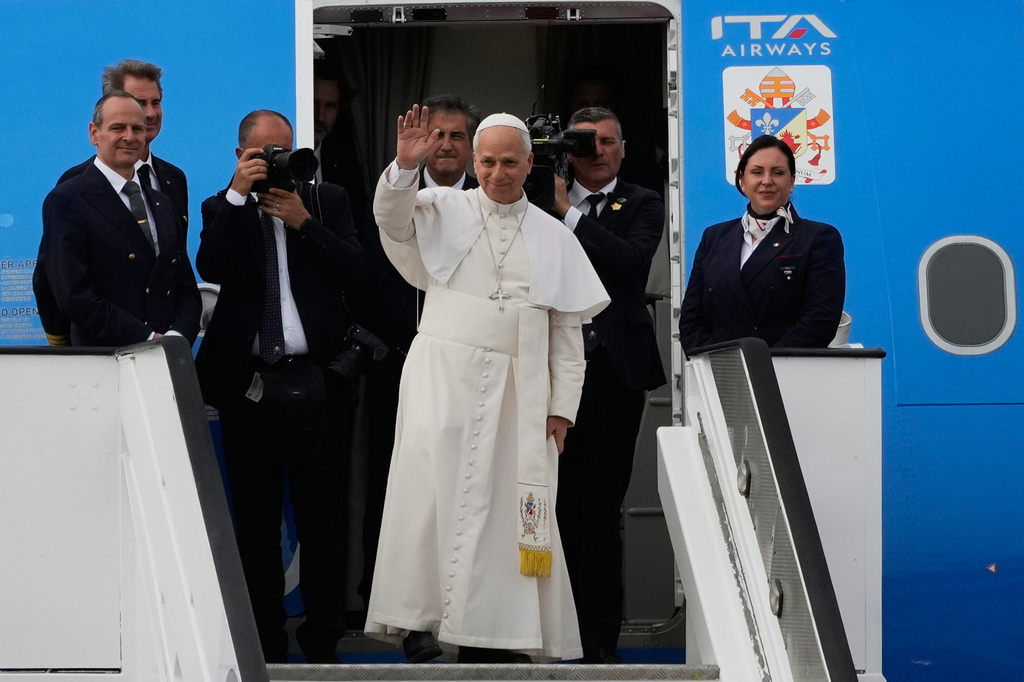 Pope Leo XIV waves as he departs for Equatorial Guinea, in Luanda, Angola, Tuesday, April 21, 2026. (AP Photo/Themba Hadebe)