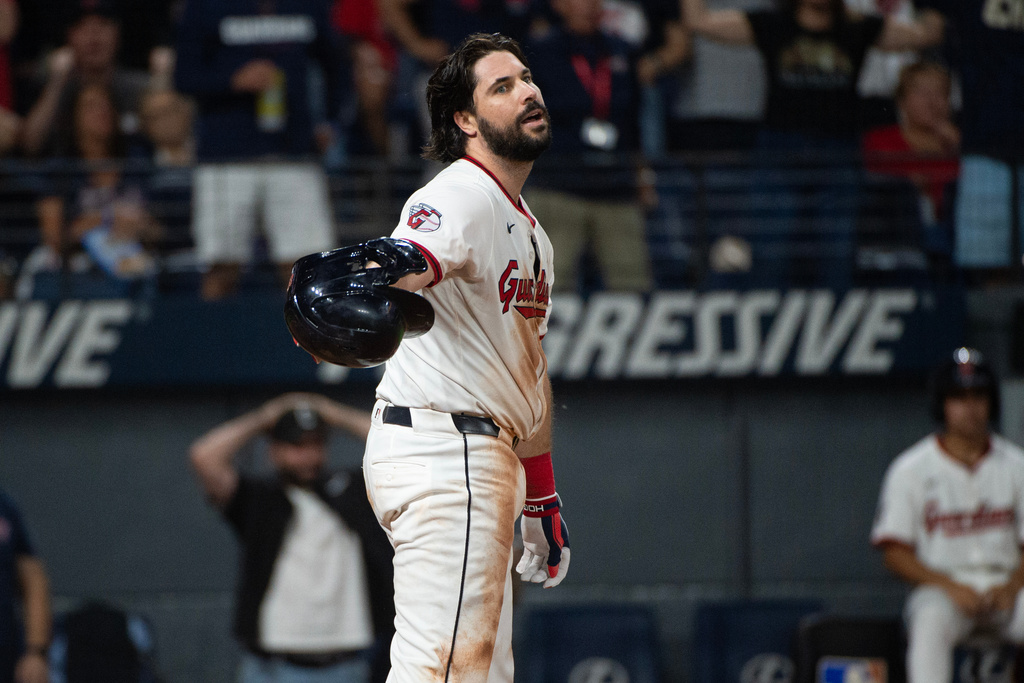 Cleveland Guardians' Austin Hedges reacts after being called out on strikes from Texas Rangers starting pitcher Jacob Latz to end the fifth inning of a baseball game, Saturday, Sept. 27, 2025, in Cleveland. (AP Photo/Phil Long)