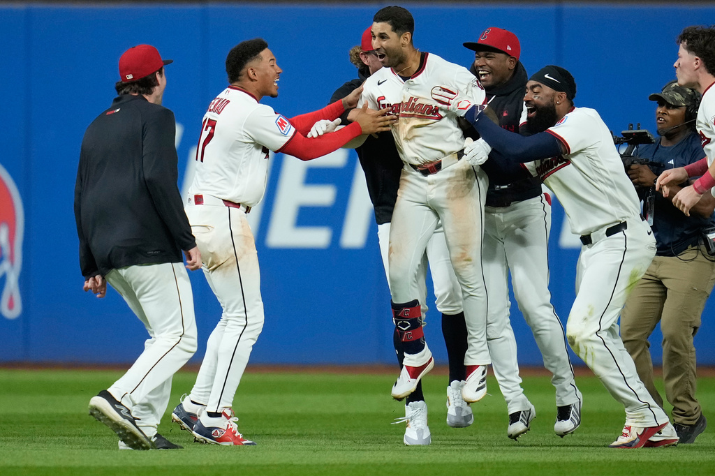 Cleveland Guardians' Brayan Rocchio, center, celebrates with teammates after hitting a game winning double in the ninth inning of a baseball game against the Chicago White Sox in Cleveland, Tuesday, Sept. 15, 2026. (AP Photo/Sue Ogrocki)