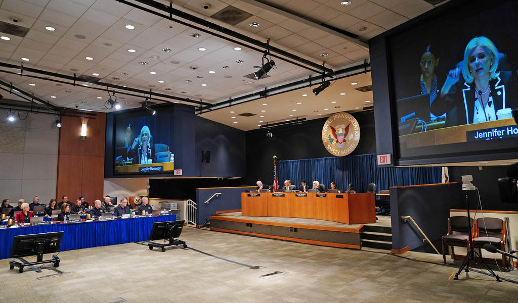 Jana Price, second from left, testifies during a National Transportation Safety Board (NTSB) hearing on the midair aircraft collision that killed 67 people near Washington Reagan National Airport, in Washington, Tuesday, Jan. 27, 2026. (Bonnie Cash/Pool via AP)