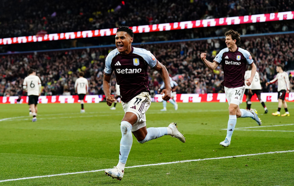 Aston Villa's Ollie Watkins celebrates scoring their side's third goal during the English Premier League soccer match between Aston Villa and Liverpool in Birmingham, England, Friday, May 15, 2026. (Jacob King/PA via AP)