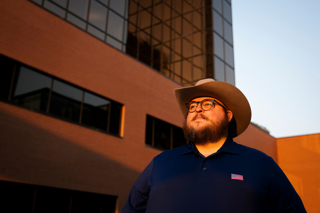 Giles Sims, who is getting a 90-hour bachelor of applied science in communication from Ensign College poses for a portrait on campus in Salt Lake City, Utah Thursday, Aug. 6, 2026, in Salt Lake City. (AP Photo/Marielle Scott)